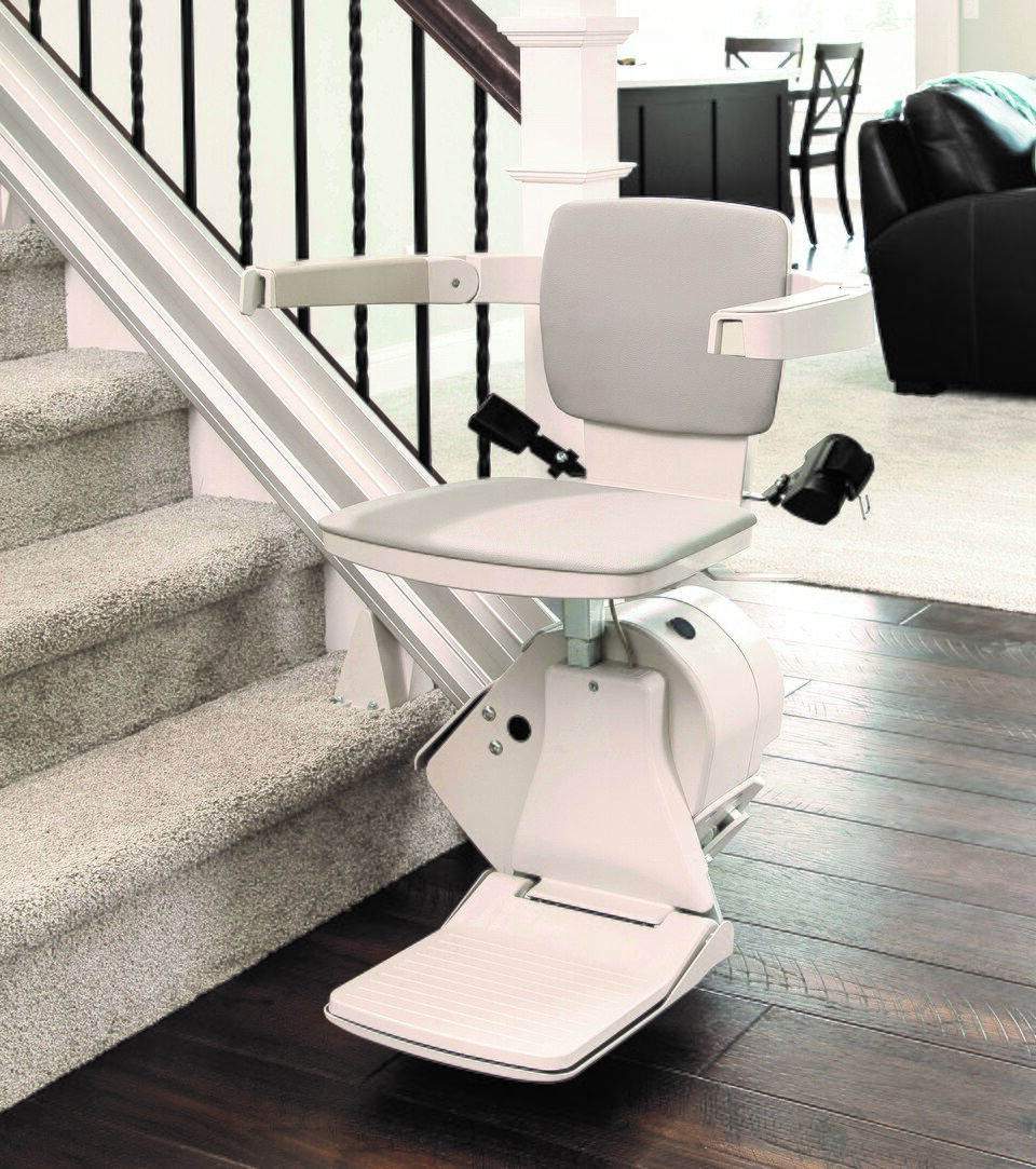 Bruno Elan straight stairlift beside a residential staircase